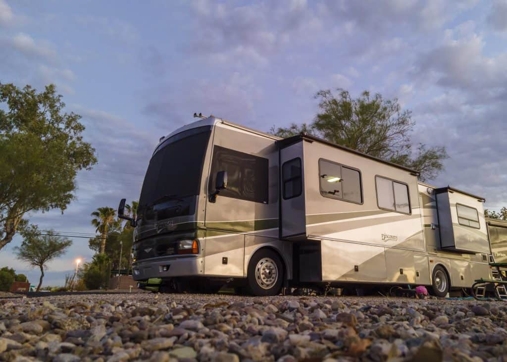 Bus parked under cloudy Tucson sky as my rv art studio