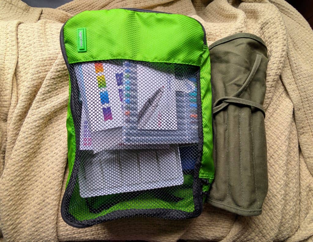 organizing my rv art studio with packing cubes and a canvas brush roll