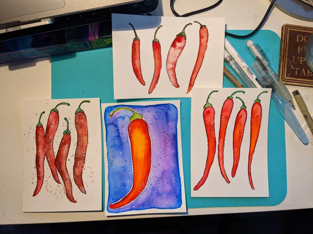 Art supplies for small spaces including watercolor journal, paints, and brushes