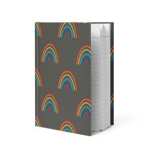 Rainbow pattern hardcover journal with hand-drawn textured rainbows in red, orange, yellow, teal, blue, and pink on gray background