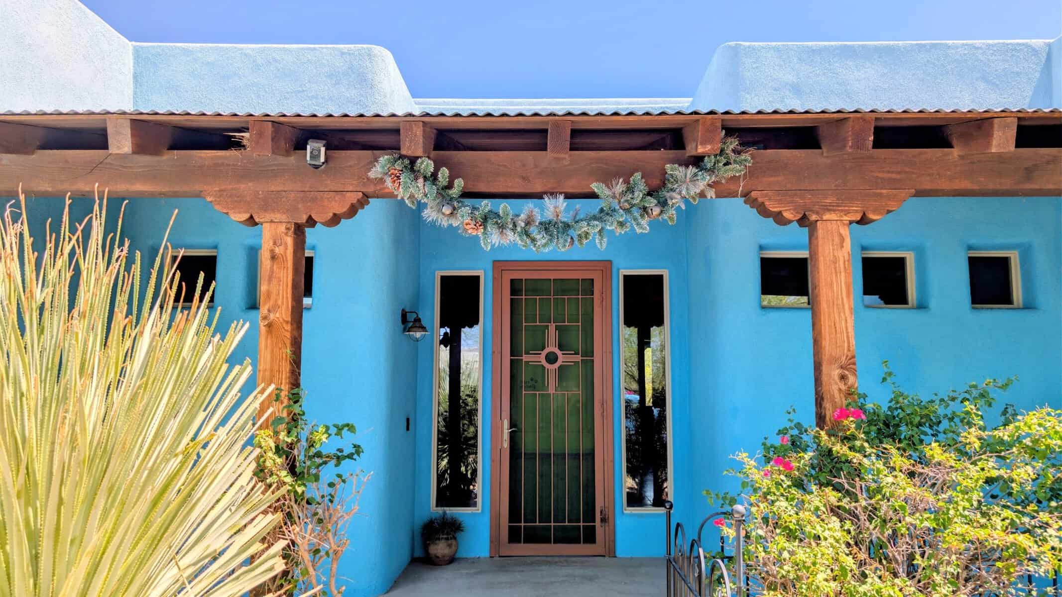 blue santa fe house in the sonoran desert