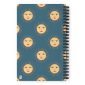 Bright sun and moon face pattern on a spiral notebook cover, cheerful summer-themed design.