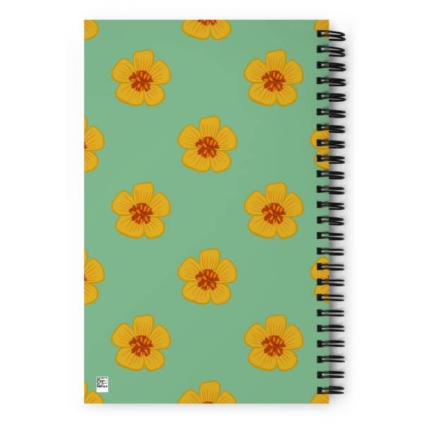 spiral-notebook-white-back-690e2bfd95523.jpg Vibrant yellow flower pattern notebook cover on pastel green background.