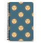 Celestial spiral notebook with hand-drawn golden sun faces on desert blue hardcover with dotted pages