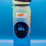 Water bottle with mountain and sun sticker, Get Out Gear logo, hydration, outdoor gear, travel water container.
