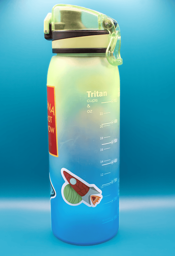 water bottle with rocket sticker 2000px Bright green Tritan water bottle with a rocket sticker on a blue background.